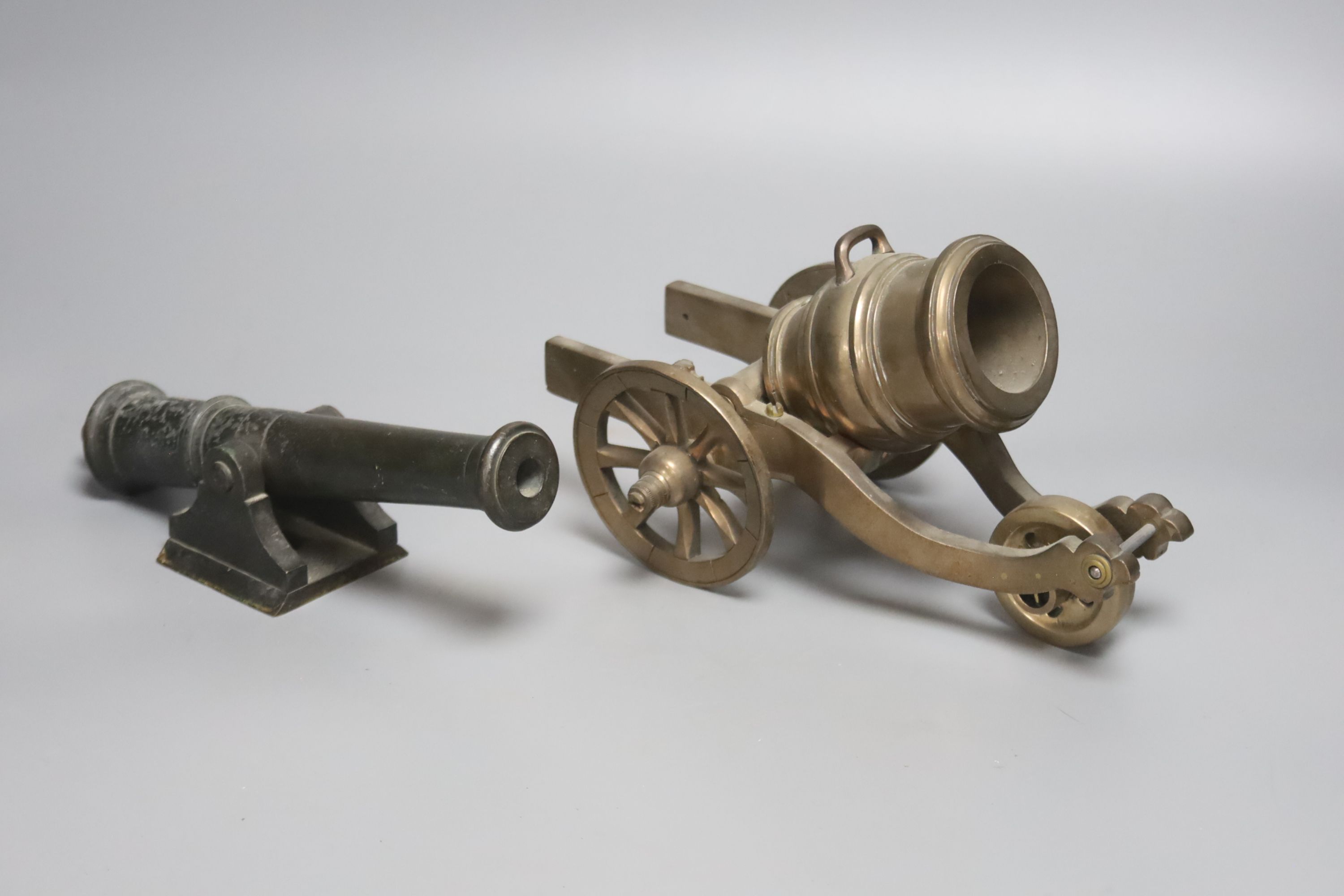 A bronze model of a mortar and carriage, 23.5cm and a bronze model cannon with pinion, 22.5cm